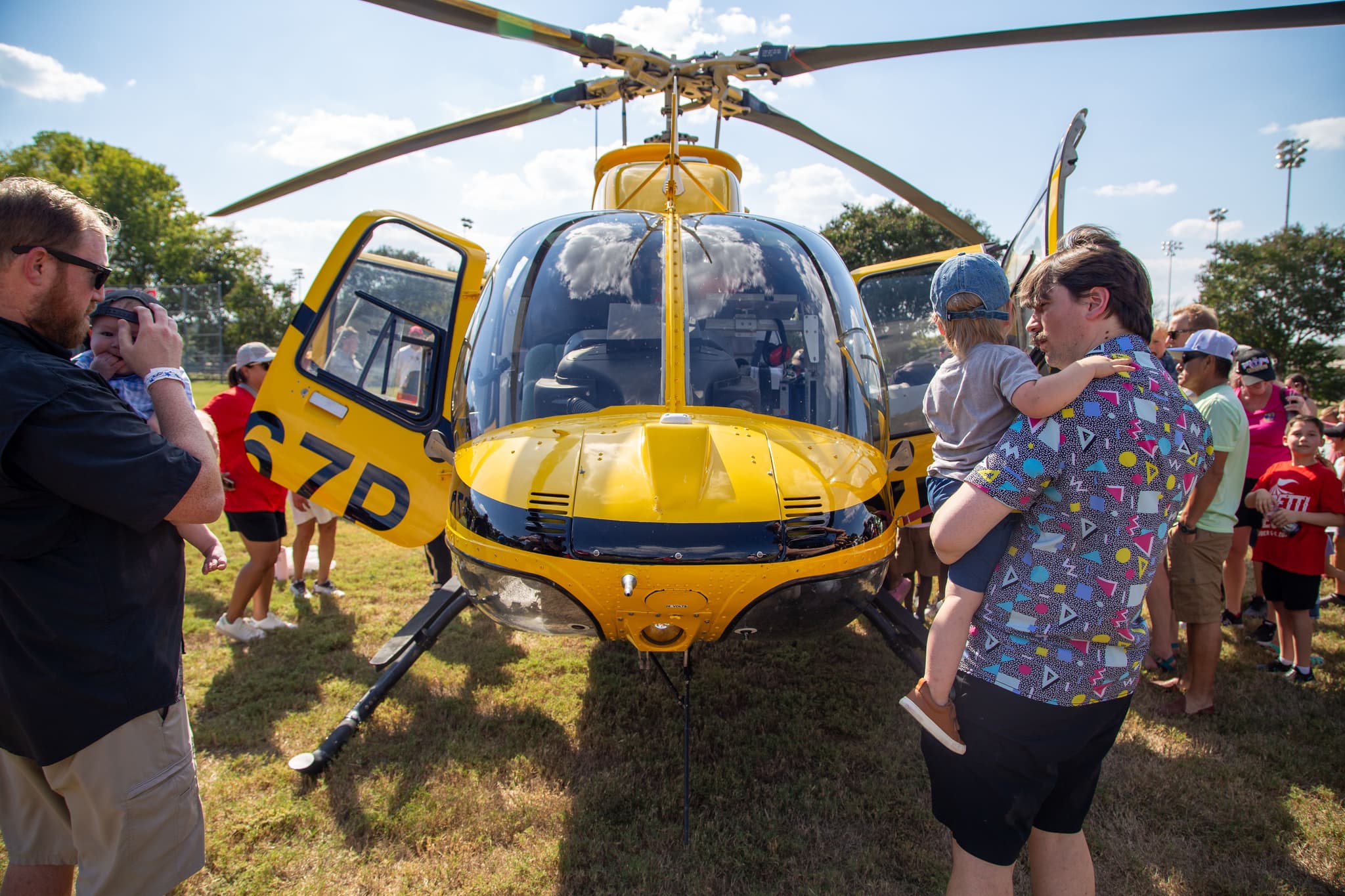 GorettiFest families and children gather around a helicopter in Arlington