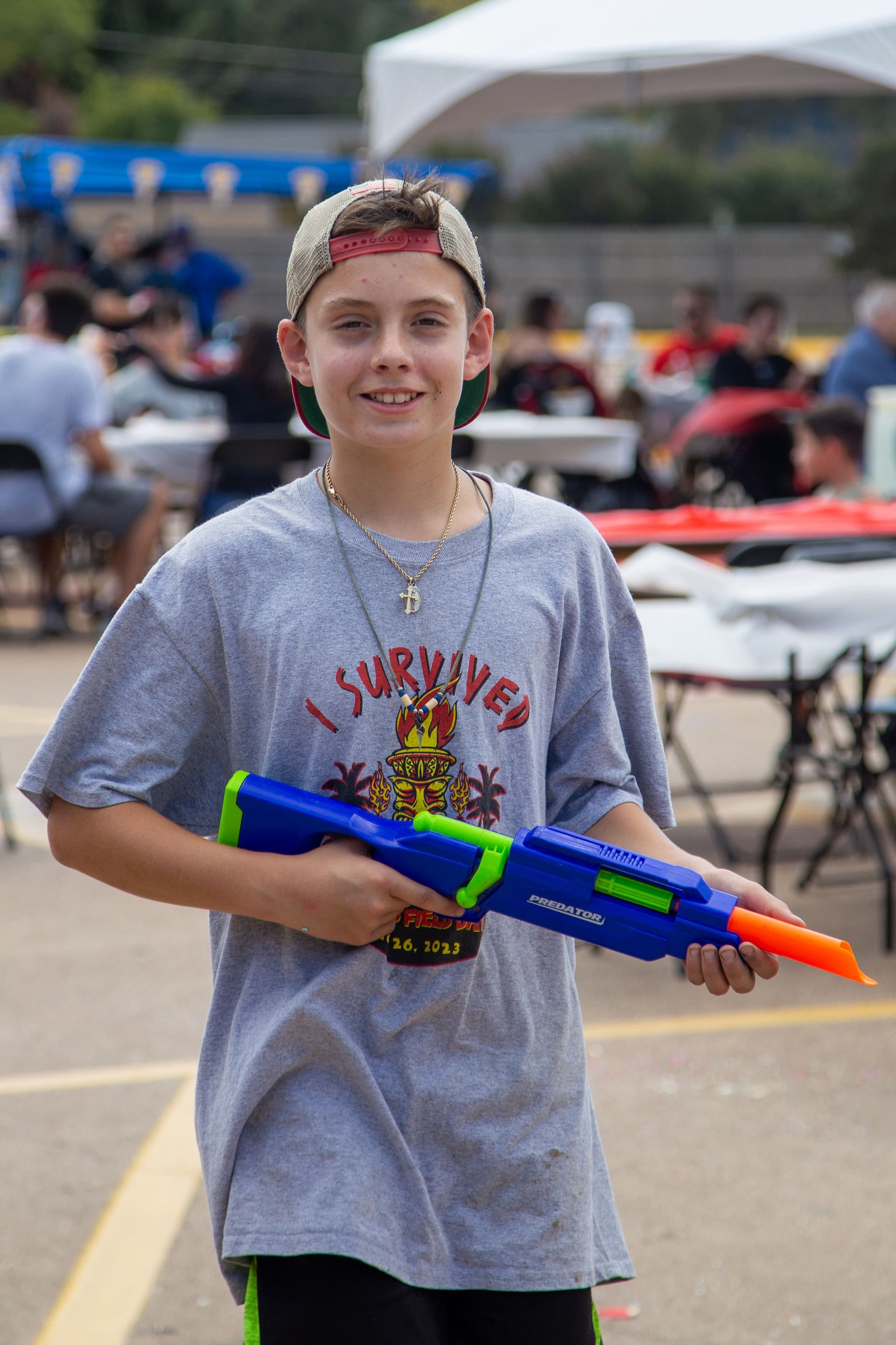 A child plays with a toy super soaker at GorettiFest in Arlington