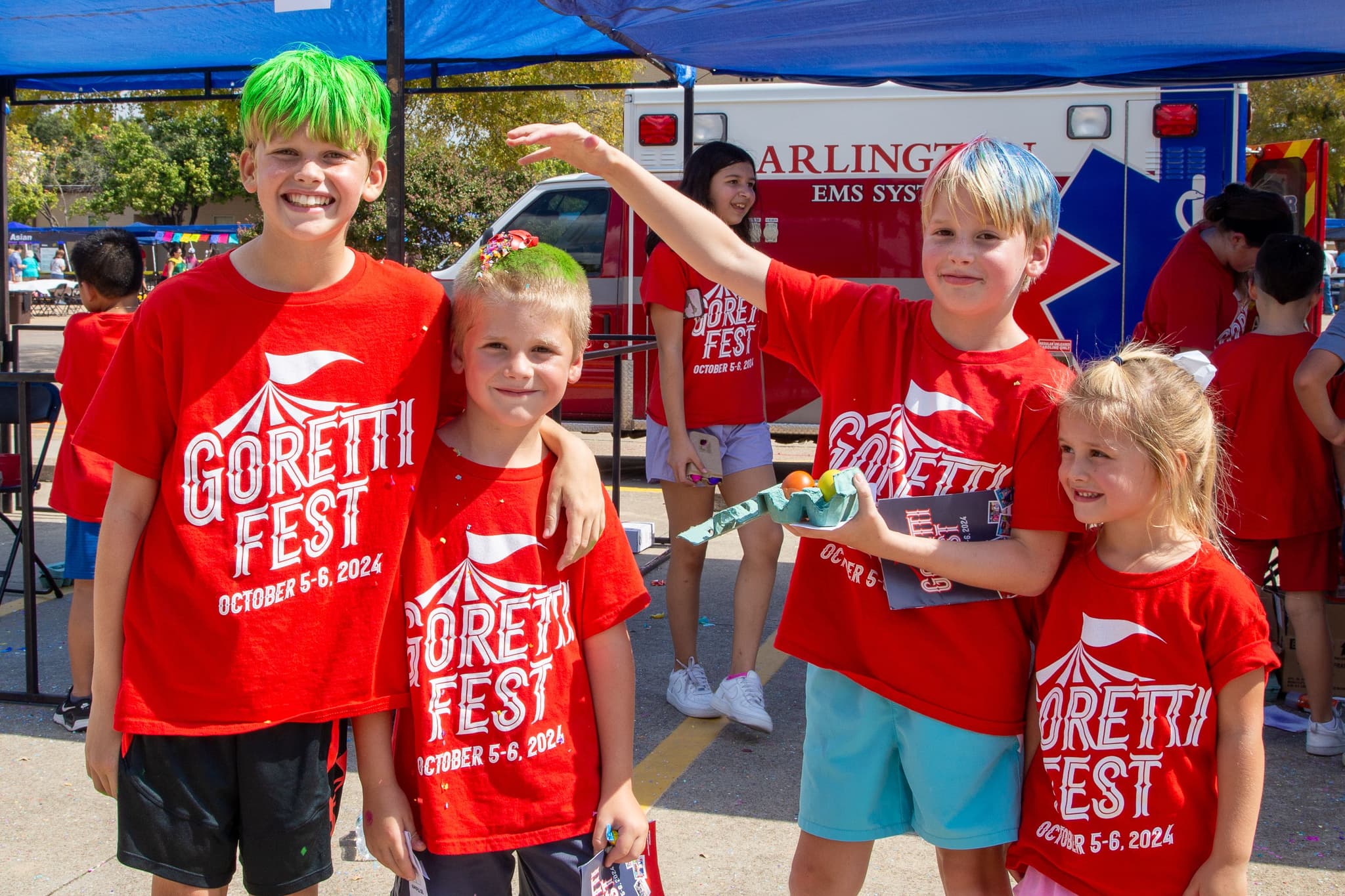 Siblings pausing for a photo while playing games at GorettiFest