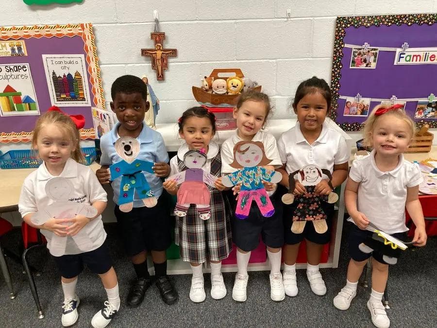 PreK students with small versions of themselves